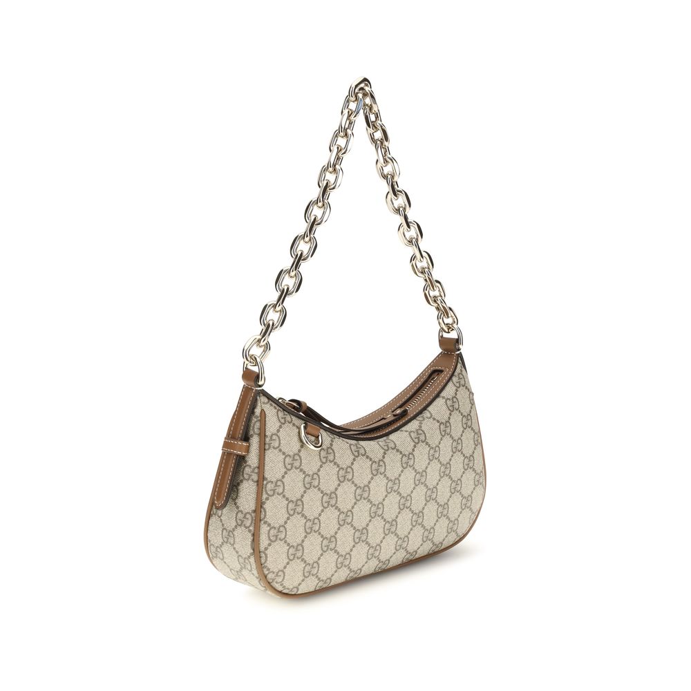 Bolso al hombro GG Emblem pequeño en tejido