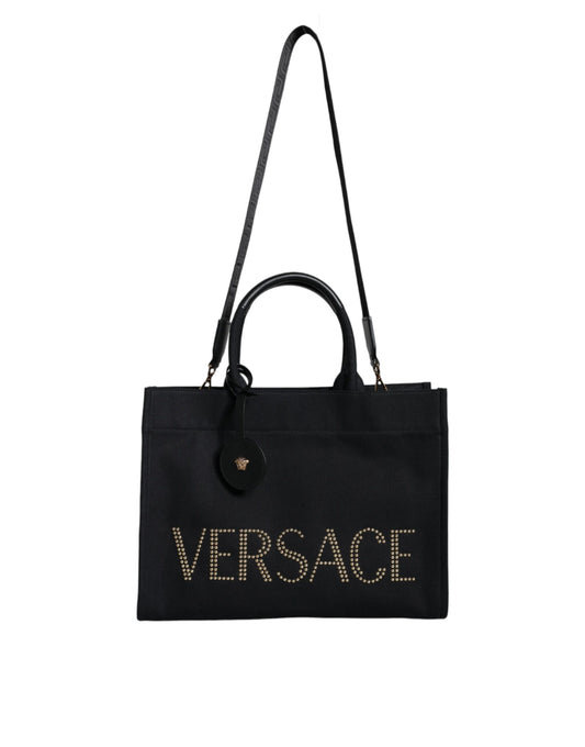 Bolso bandolera de lona negra con asa superior, de cuero y logotipo