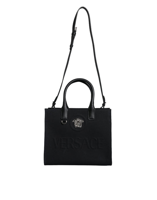 Bolso bandolera de lona negra con asa superior, de cuero y logotipo